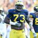Michigan defensive tackle William Campbell beats his belly as he pumps up the crowd during overtime against Northwestern at Michigan Stadium on Saturday. Melanie Maxwell I AnnArbor.com